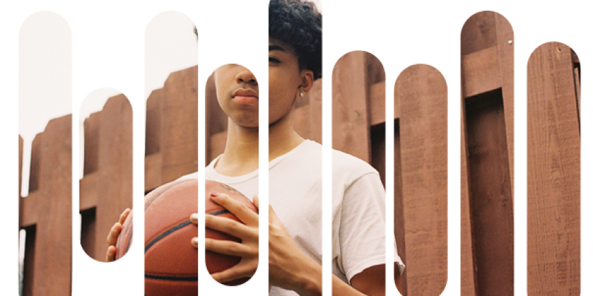 Young man in a t-shirt holding a basketball